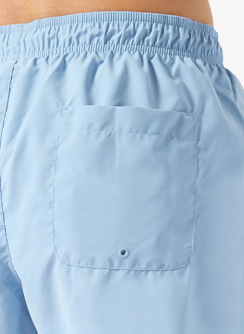 LACOSTE  Monochrome Swim Trunks for Men | Best Price UAE